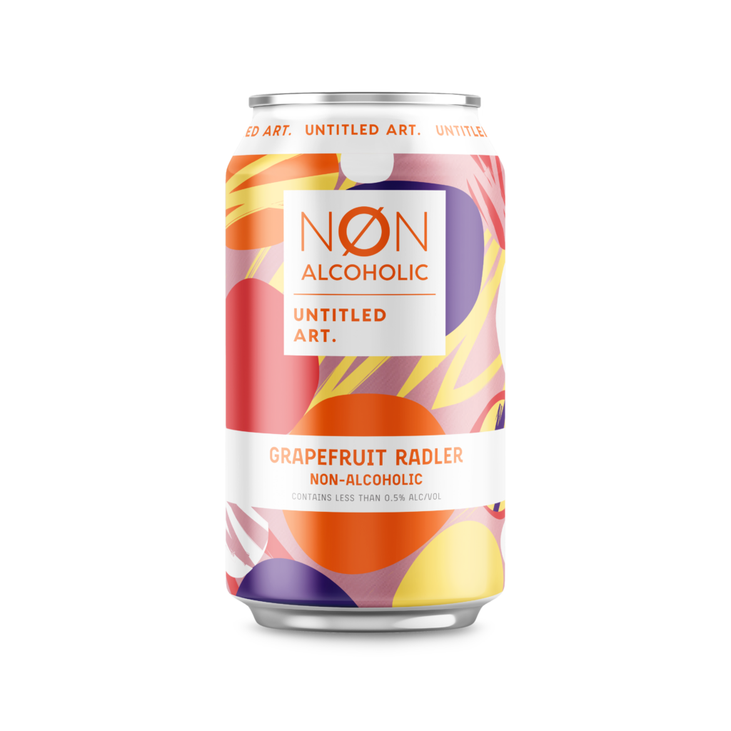 A six-pack of Non-Alcoholic Grapefruit Radler with a colorful abstract design, containing less than 0.5% alcohol.